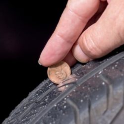 Inspecting tire tread with penny