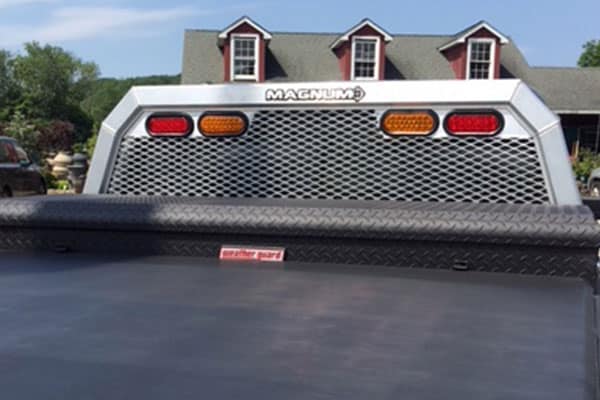 Ram 1500 with Low Pro mesh headache rack, tool box, and tonneau cover installed.