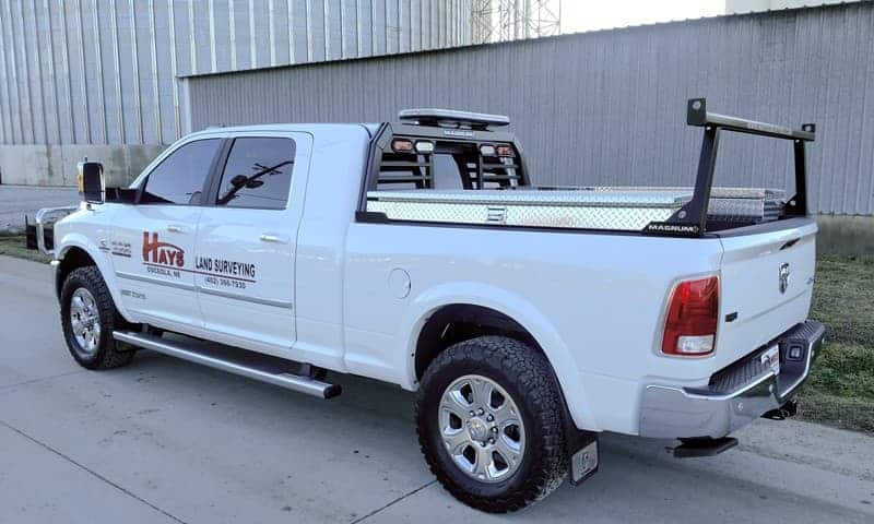 cab high headache rack by Magnum on white pickup truck with rear rack