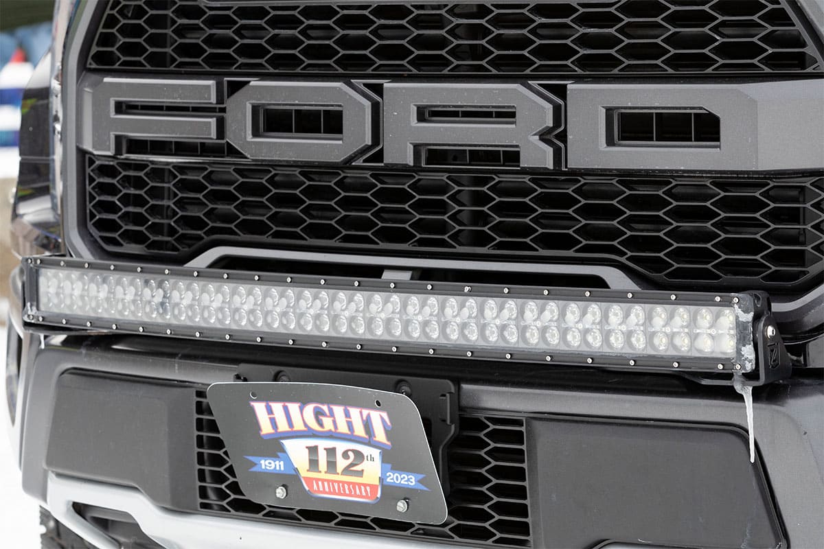 Ford truck with LED light bar installed on the front grille.