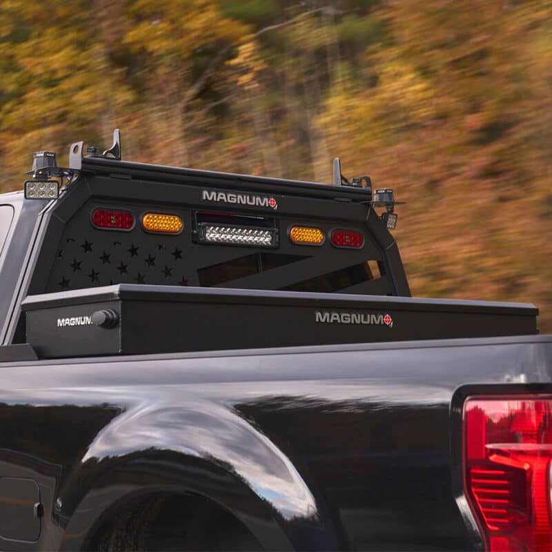 truck bed toolbox in black pickup truck also showing american flag headache rack